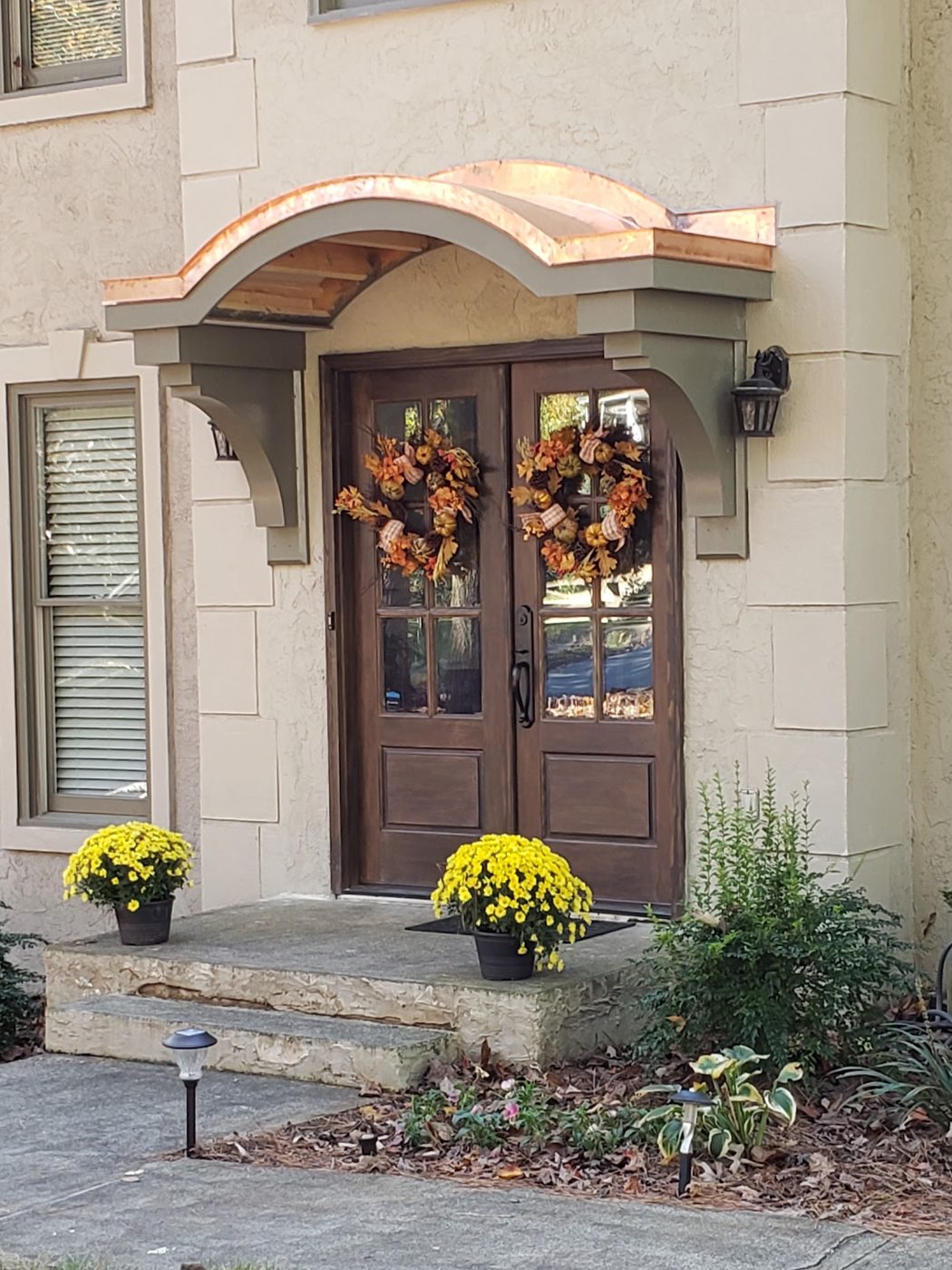 Curved copper entry awning