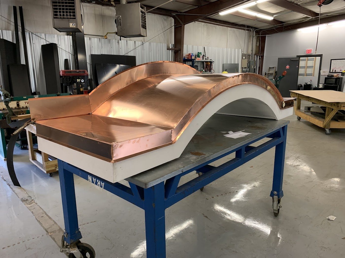 Copper range hood being fabricated in the shop